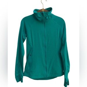 New Balance long sleeve zip up jacket with overlap thumb hole details.
